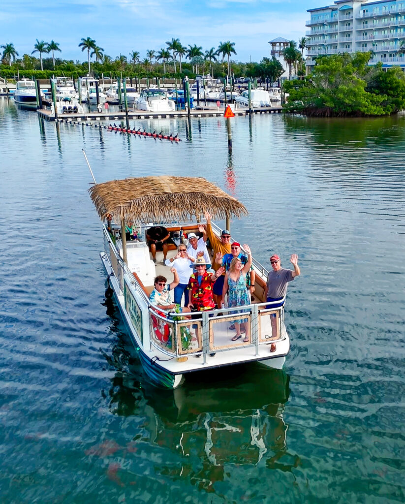 Guests enjoying a guided boat tour aboard Rum Barge Adventures
