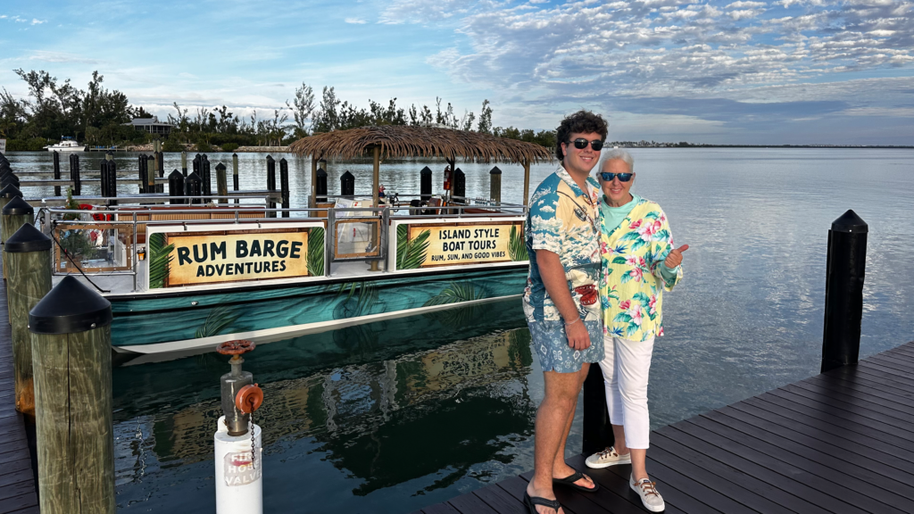 James Kleiner with Captain Denise in front of the Rum Barge
